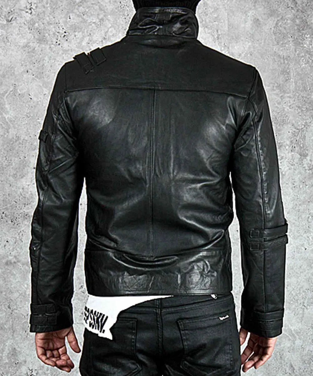 Black leather jacket worn by a person on a gray background