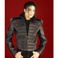 Person wearing a black leather jacket with a red background