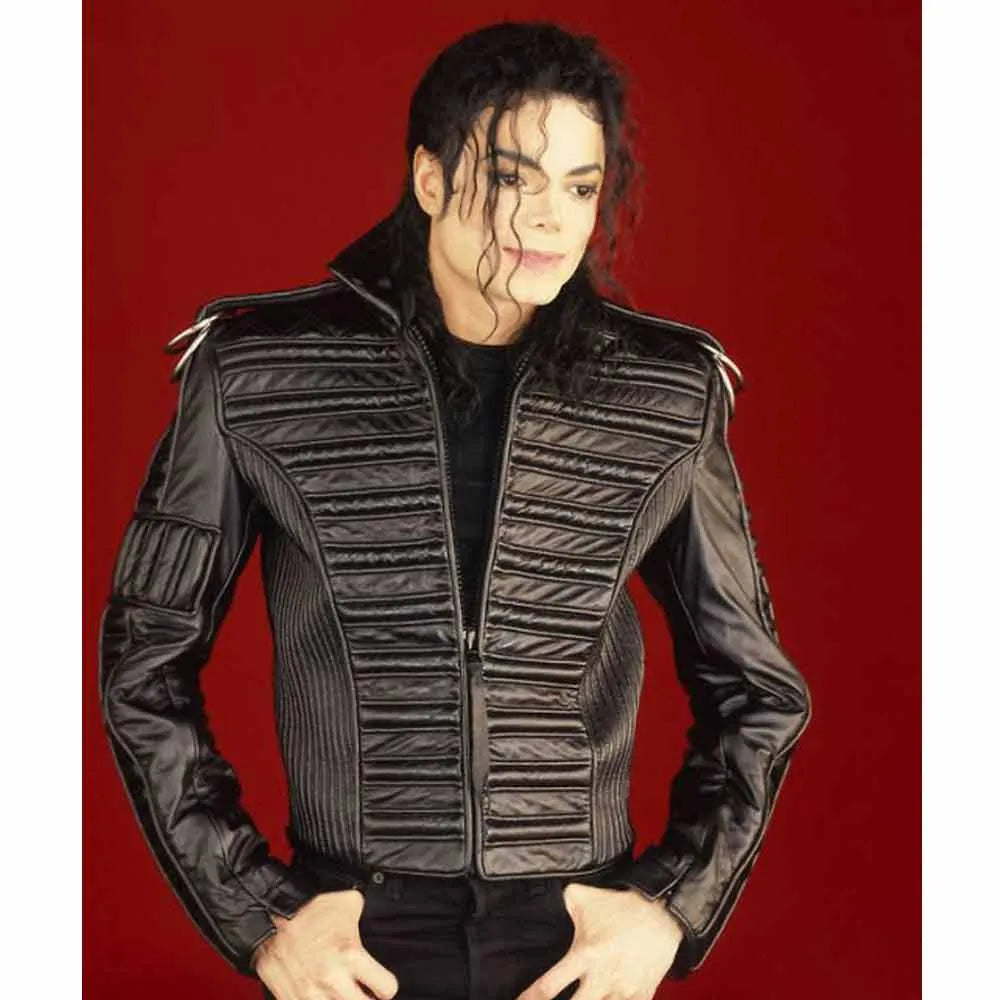 Person wearing a black leather jacket with a red background