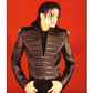 Person wearing a black quilted jacket against a background