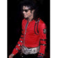 Person wearing a red jacket with black accents and a silver belt, against a dark background