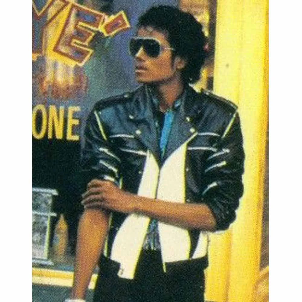 Person wearing a black and white jacket with a colorful background